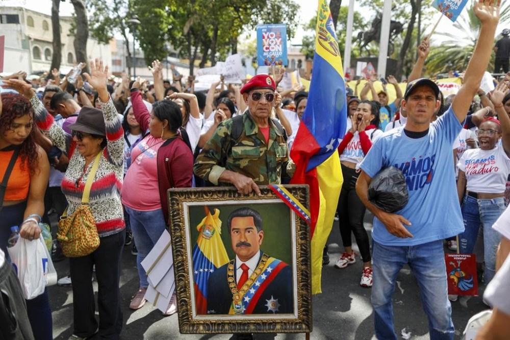 Government supporters gather for President Nicolas Maduro's opening campaign rally ahead of July 28 elections in Caracas, Venezuela, Thursday, July 4, 2024. (AP Photo/Cristian Hernandez)