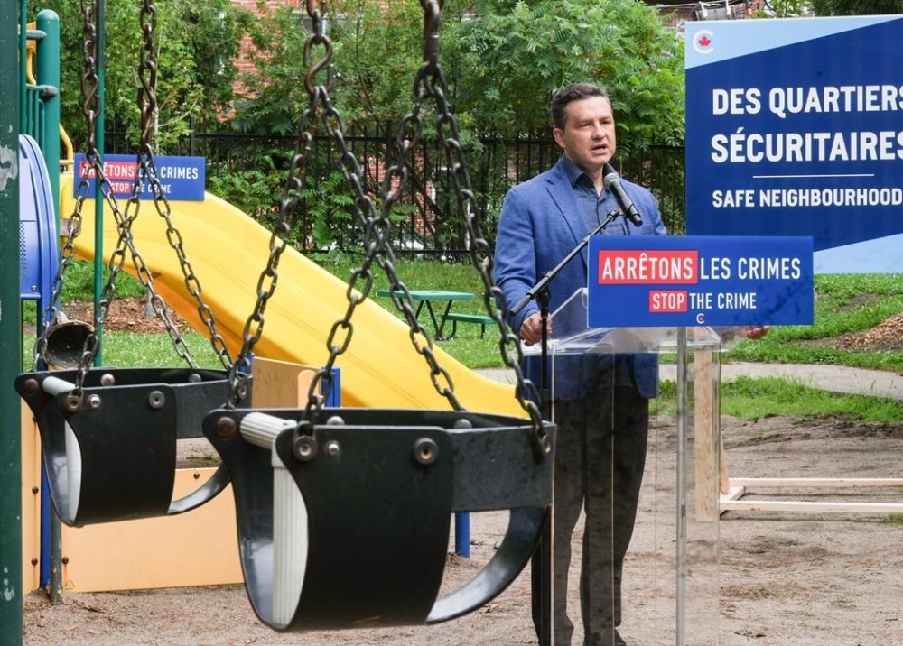 Federal Conservative Leader Pierre Poilievre speaks to the media in a school park during a press conference in Montreal, Friday, July 12, 2024. THE CANADIAN PRESS/Christinne Muschi