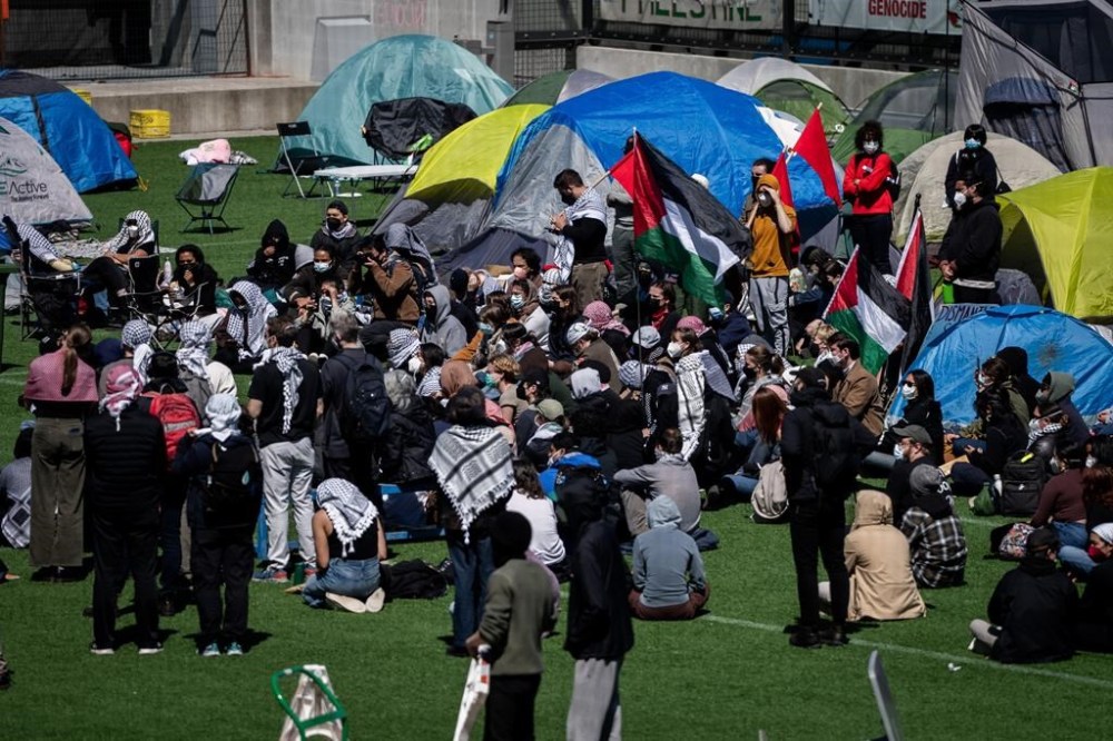 Vancouver Island University says it has issued a trespass notice to pro-Palestinian protesters, telling them to vacate their encampment on the campus in Nanaimo, B.C., by Monday. People gather and pitch tents at a pro-Palestinian encampment at the University of British Columbia campus in Vancouver, Monday, April. 29, 2024. THE CANADIAN PRESS/Ethan Cairns
