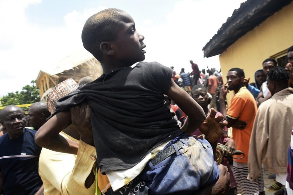 A student is rescued from the rubble of a collapsed two-storey building in Jos, Nigeria, Friday, July, 12, 2024. At least 12 students have been killed after a school building collapsed and trapped them in northern Nigeria, authorities said on Friday. (AP Photos)