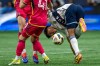 Vancouver Whitecaps' Mathias Laborda, right, watches the ball as he trips beside St. Louis City's John Klein (41) during the first half of an MLS soccer match in Vancouver, B.C., Saturday, June 29, 2024. The Major League Soccer season has been a journey for the Whitecaps — literally. THE CANADIAN PRESS/Ethan Cairns