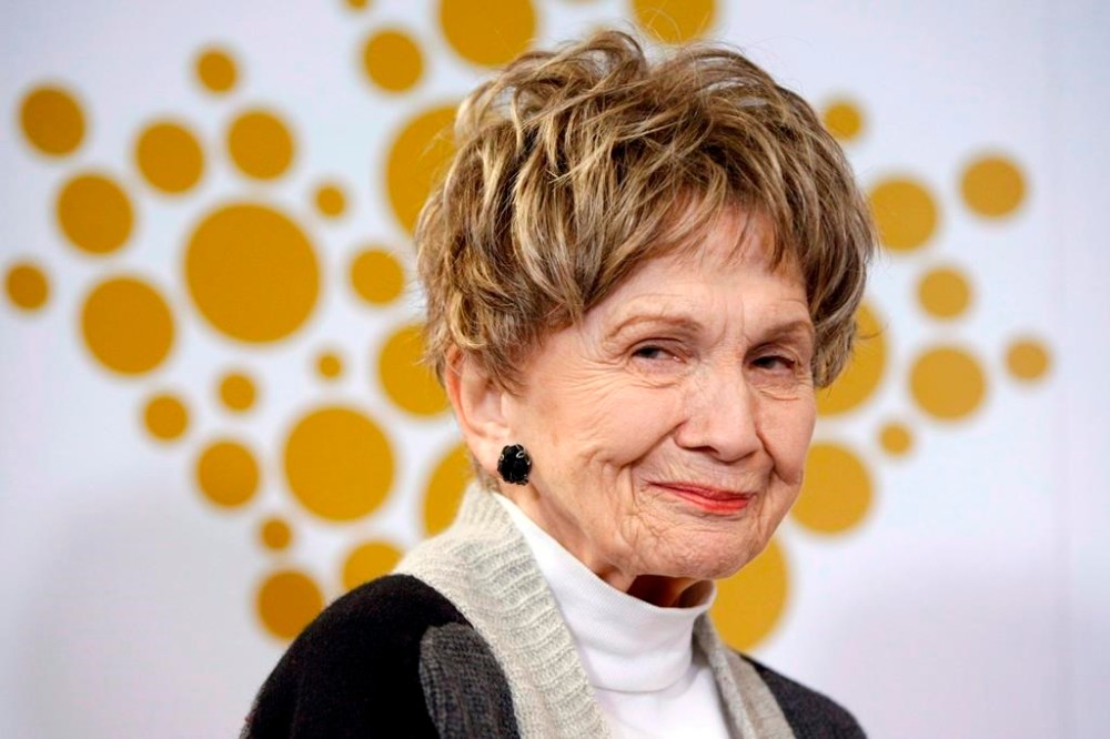 Alice Munro's alma mater has paused the endowed chair program that bears her name after her daughter revealed the writer protected the husband who sexually abused her as a child. Munro attends a ceremony held by the Royal Canadian Mint to celebrate her win where they unveiled a 99.99% pure silver five-dollar coin at the Great Victoria Public Library in Victoria on Monday, March 24, 2014. THE CANADIAN PRESS/Chad Hipolito