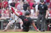 Cincinnati Reds' Rece Hinds (77) scores against Miami Marlins catcher Ali Sánchez on Will Benson's double during the second inning of a baseball game, Friday, July 12, 2024, in Cincinnati. (AP Photo/Jeff Dean)