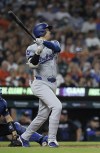 Los Angeles Dodgers' Shohei Ohtani hits a double that bounced over the center field wall to drive in one run and take a lead over the Detroit Tigers in the ninth inning of a baseball game Friday, July 12, 2024, in Detroit. (AP Photo/Duane Burleson)