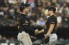 Pittsburgh Pirates' Joey Bart, left, celebrates with David Bednar, right, after their win over the Chicago White Sox, Friday, July 12, 2024, in Chicago. (AP Photo/Melissa Tamez)