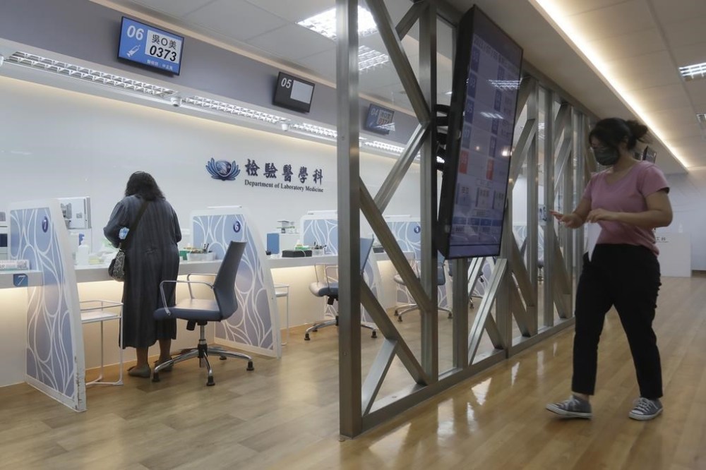 People visit the department of laboratory medicine for testing at the Tzu Chi Hospital in Hualien, Taiwan, Wednesday, July 5, 2023. In 1966, (AP Photo/Chiang Ying-ying)