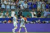 Argentina's Lautaro Martínez (22) celebrates scoring his side's second goal against Peru with teammate Valentín Carboni during a Copa America Group A soccer match in Miami Gardens, Fla., Saturday, June 29, 2024. (AP Photo/Rebecca Blackwell)