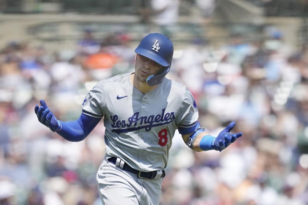 Los Angeles Dodgers' Enrique Hernández looks towards the dugout and reacts after his two-run home run during the seventh inning of a baseball game against the Detroit Tigers, Saturday, July 13, 2024, in Detroit. (AP Photo/Carlos Osorio)