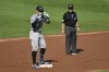 New York Yankees' Aaron Judge, left, gestures after hitting a double off Baltimore Orioles pitcher Grayson Rodriguez during the third inning of a baseball game, Saturday, July 13, 2024, in Baltimore. (AP Photo/Terrance Williams)