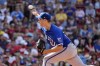 Kansas City Royals starting pitcher Seth Lugo throws against the Boston Red Sox during the first inning of a baseball game, Saturday, July 13, 2024, in Boston. (AP Photo/Michael Dwyer)