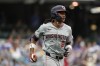 Washington Nationals' CJ Abrams rounds the bases after hitting a two-run home run during the ninth inning of a baseball game against the Milwaukee Brewers, Saturday, July 13, 2024, in Milwaukee. (AP Photo/Aaron Gash)