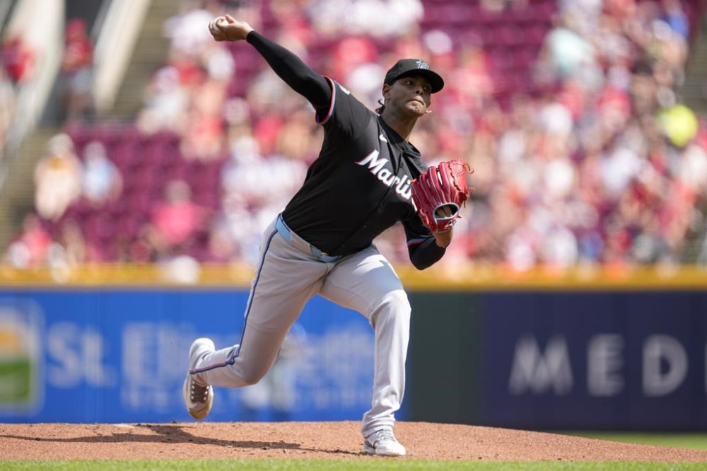Miami Marlins pitcher Edward Cabrera throws during the first inning of a baseball game against the Cincinnati Reds, Saturday, July 13, 2024, in Cincinnati. (AP Photo/Jeff Dean)