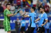 Uruguay's goalkeeper Sergio Rochet celebrates with teammates after defeating Canada in a penalty shootout during the Copa America third place soccer match in Charlotte, N.C., Saturday, July 13, 2024. (AP Photo/Jacob Kupferman)