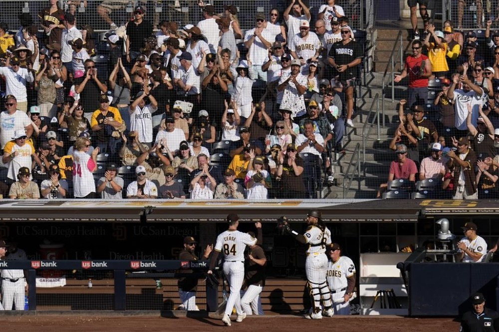 Fans applaud San Diego Padres starting pitcher Dylan Cease (84) as he exits during the sixth inning of a baseball game against the Atlanta Braves, Saturday, July 13, 2024, in San Diego. (AP Photo/Gregory Bull)