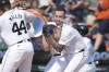 Detroit Tigers' Gio Urshela is doused by Jake Rogers after hitting a two-run home run during the 10th inning of a baseball game against the Los Angeles Dodgers, Saturday, July 13, 2024, in Detroit. (AP Photo/Carlos Osorio)