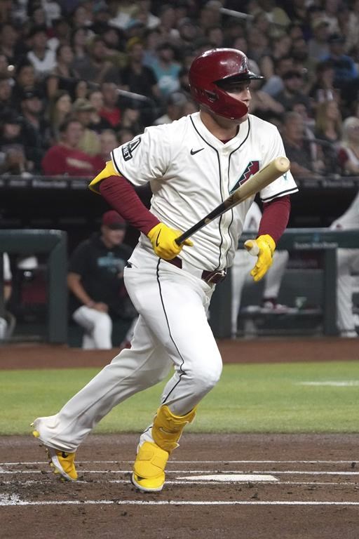 Arizona Diamondbacks' Joc Pederson watches his RBI double against the Toronto Blue Jays in the first inning during a baseball game, Saturday, July 13, 2024, in Phoenix. (AP Photo/Rick Scuteri)