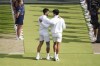 Carlos Alcaraz speaks with Novak Djokovic after the men's singles final at the Wimbledon tennis championships in, Sunday, July 14, 2024. (John Walton/PA via AP)