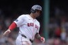 Boston Red Sox's Rafael Devers runs the bases after hitting a two-run home in the first inning of a baseball game against the Kansas City Royals, Sunday, July 14, 2024, in Boston. (AP Photo/Steven Senne)