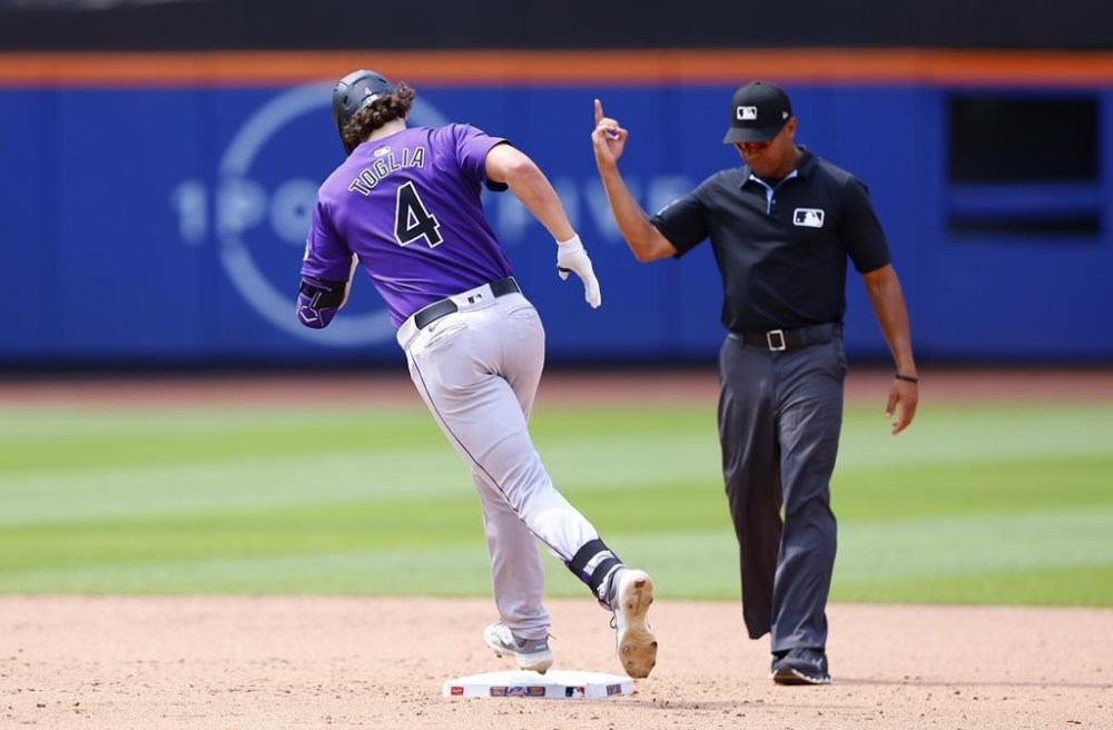 Colorado Rockies' Michael Toglia (4) runs the bases after hitting a home run against the New York Mets during the sixth inning of a baseball game, Sunday, July 14, 2024, in New York. (AP Photo/Noah K. Murray)