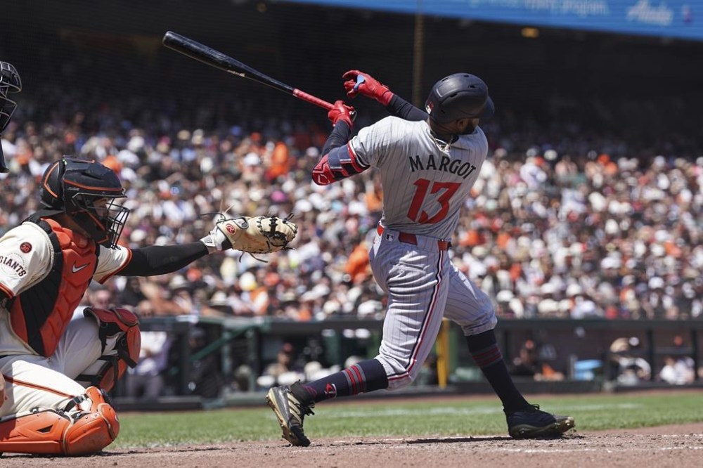 Minnesota Twins' Manuel Margot hits a single against the San Francisco Giants during the seventh inning of a baseball game in San Francisco, Sunday, July 14, 2024. (AP Photo/Kavin Mistry)