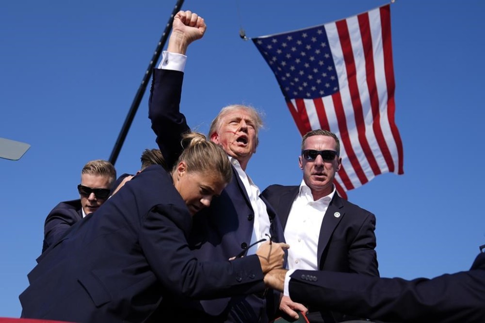The Prime Minister's office says he spoke this afternoon with former president Donald Trump in the wake of a shooting at a rally Saturday. Trump is surrounded by U.S. Secret Service agents at a campaign rally, Saturday, July 13, 2024, in Butler, Pa. THE CANADIAN PRESS/AP, Evan Vucci