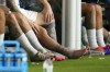 Argentina's Lionel Messi sits on the bench with an ice pack on his ankle during a Copa America soccer final match against Colombia in Miami Gardens, Fla., Sunday, July 14, 2024. (AP Photo/Julio Cortez)