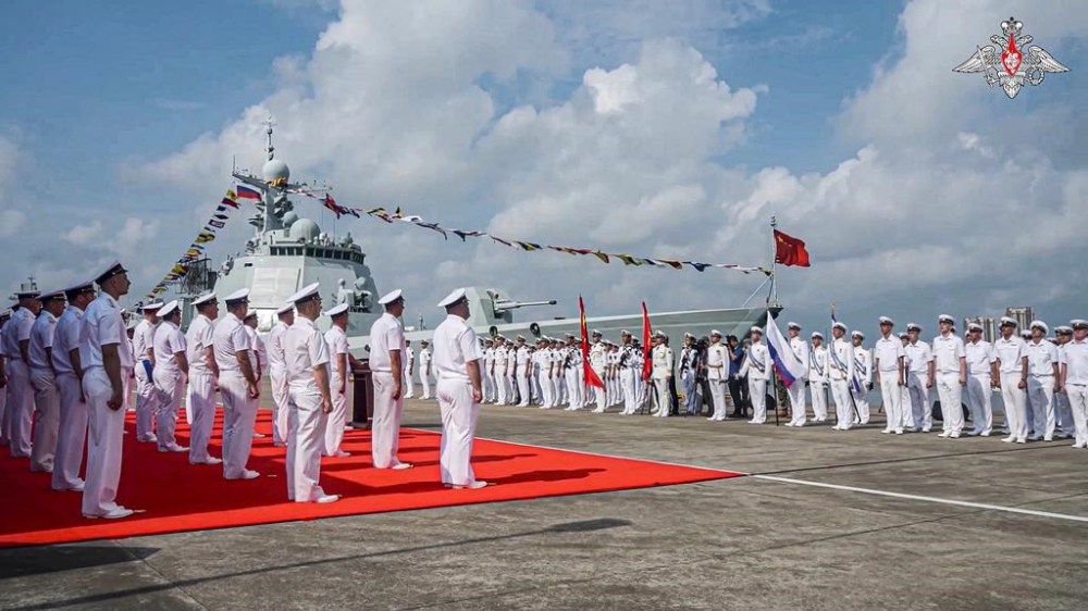 In this photo taken from video released by Russian Defense Ministry Press Service Monday, July 15, 2024, Russian military sailors attend a welcome ceremony of their joint naval forces exercise at a port in Zhanjiang, Guangdong province, China, Sunday July 14, 2024. China and Russia's naval forces have kicked off a joint exercise at a military port in southern China on Sunday, official news agency Xinhua reported, days after NATO allies called Beijing a