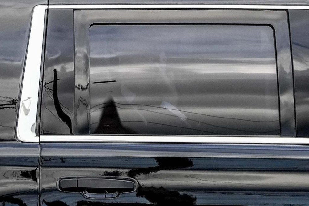 Former President Trump waves to supporters after arriving to the Milwaukee Mitchell International Airport ahead of the 2024 Republican National Convention, Sunday, July 14, 2024, in Milwaukee. (AP Photo/Alex Brandon)