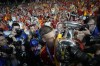Spain's Dani Olmo celebrates with the trophy after winning the final match between Spain and England at the Euro 2024 soccer tournament in Berlin, Germany, Sunday, July 14, 2024. (AP Photo/Matthias Schrader)