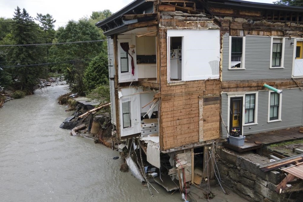 FILE - The remains of an eight unit apartment building that locals call the Heartbreak Hotel are in Plainfield, Vermont, on July 12, 2024, after flood waters and debris caused by the aftermath of Hurricane Beryl pulled several of the apartments into the Great Brook waterway. Vermont is seeking a federal assessment to determine whether last week’s flooding, which damaged homes, knocked out bridges and washed out roads, qualifies for a federal disaster declaration and aid. (AP Photo/Ted Shaffrey, file)