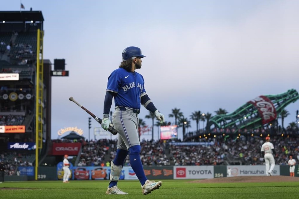 Toronto Blue Jays' Bo Bichette walks to the dugout after striking out against the San Francisco Giants during the sixth inning of a baseball game Tuesday, July 9, 2024, in San Francisco. (AP Photo/Godofredo A. Vásquez)