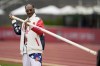 Play entertainer, Snoop Dogg gets a pole vault lesson during the U.S. Track and Field Olympic Team Trials Sunday, June 23, 2024, in Eugene, Ore. (AP Photo/Charlie Neibergall)