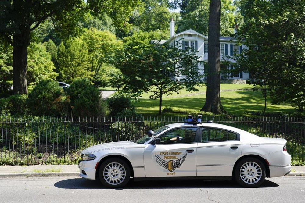 Security vehicles are parked outside the home of Ohio Sen. JD Vance, who is on Donald Trump's vice presidential short list, Monday, July 15, 2024, in Cincinnati. (AP Photo/Jeff Dean)