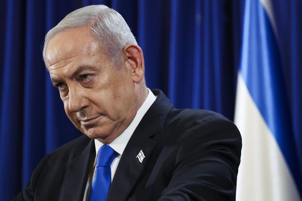 Israeli Prime Minister Benjamin Netanyahu pauses during a press conference in Tel Aviv, Israel, Saturday July 13, 2024. (Nir Elias/Pool Photo via AP)