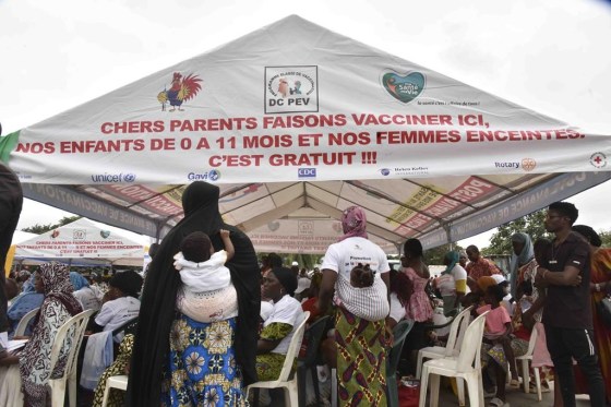 Women wait to administer the malaria vaccine Oxford-Serum R21 to their children in Abidjan, Ivory Coast, Monday. (Diomande Ble Blonde / The Associated Press)