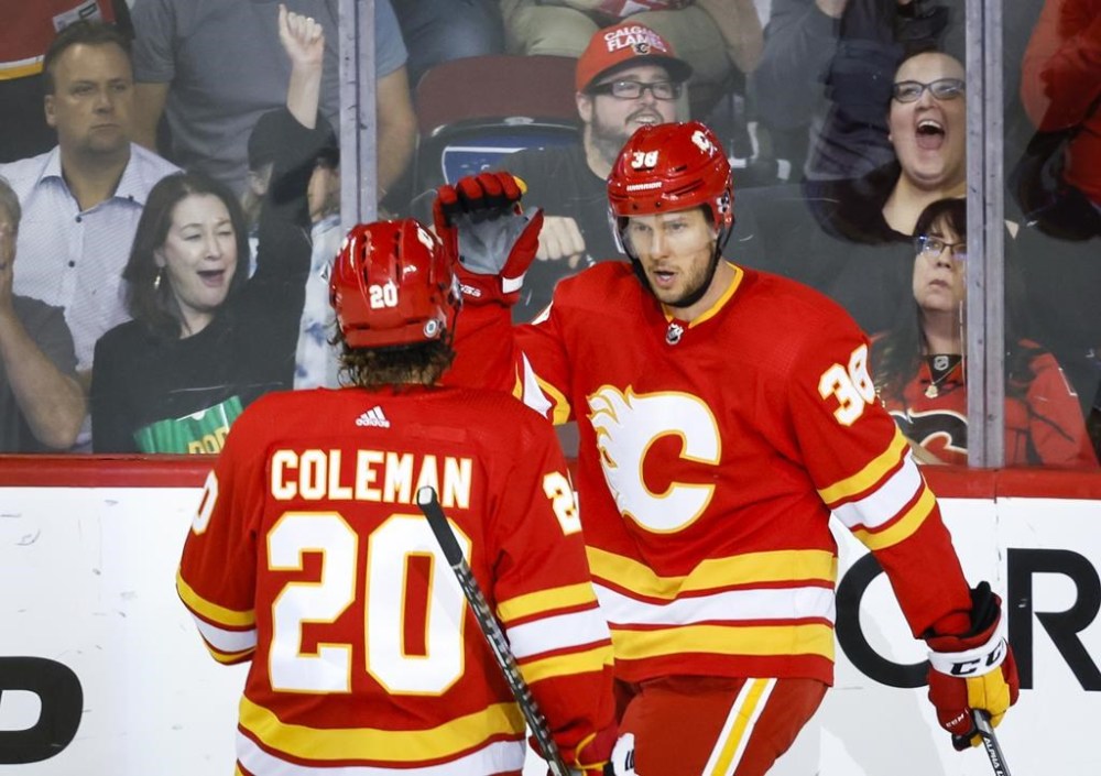 Calgary Flames centre Brett Sutter, right, celebrates his goal with teammate forward Blake Coleman during second period NHL pre-season hockey action against the Edmonton Oilers in Calgary on September 28, 2022. The son of former NHL coach Darryl Sutter played in 1,090 games in the American Hockey League and another 60 in the NHL. Sutter concluded his playing career with the Calgary Flames' AHL affiliate, the Calgary Wranglers, and will join the team's coaching staff as an assistant. THE CANADIAN PRESS/Jeff McIntosh