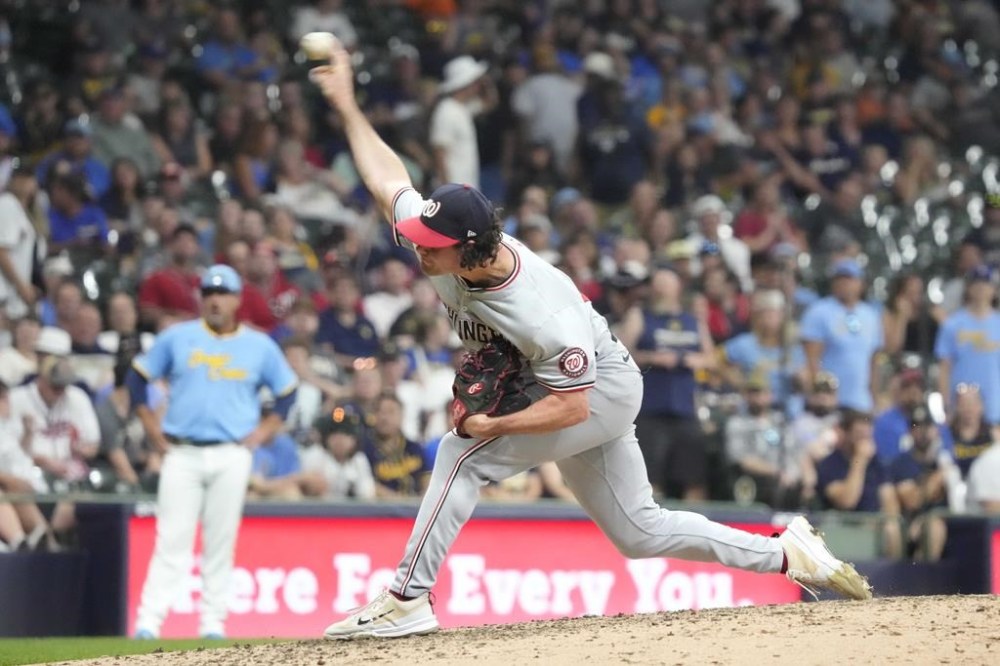 Washington Nationals pitcher Kyle Finnegan throws during the ninth inning of a baseball game against the Milwaukee Brewers, Friday, July 12, 2024, in Milwaukee. (AP Photo/Kayla Wolf)
