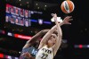 Indiana Fever guard Caitlin Clark (22) battles Atlanta Dream centre Tina Charles (31) for a rebound in the first half of a WNBA basketball game, in Atlanta, Friday, June 21, 2024. THE CANADIAN PRESS/AP-John Bazemore