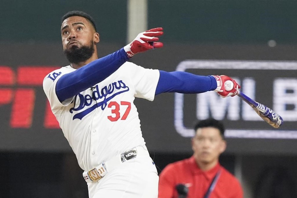 National League's Teoscar Hernandez, of the Los Angeles Dodgers, follows through during the MLB baseball All-Star Home Run Derby, Monday, July 15, 2024, in Arlington, Texas. (AP Photo/LM Otero)