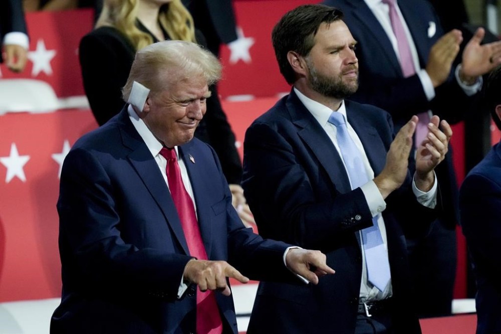 Republican presidential candidate former President Donald Trump and Republican vice presidential candidate Sen. JD Vance, R-Ohio, are seen during the Republican National Convention Monday, July 15, 2024, in Milwaukee. (AP Photo/Charles Rex Arbogast)