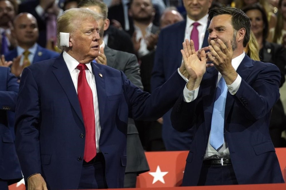 Republican presidential candidate former President Donald Trump and Republican vice presidential candidate Sen. JD Vance, R-Ohio, attend the first day of the Republican National Convention, Monday, July 15, 2024, in Milwaukee. (AP Photo/Evan Vucci)