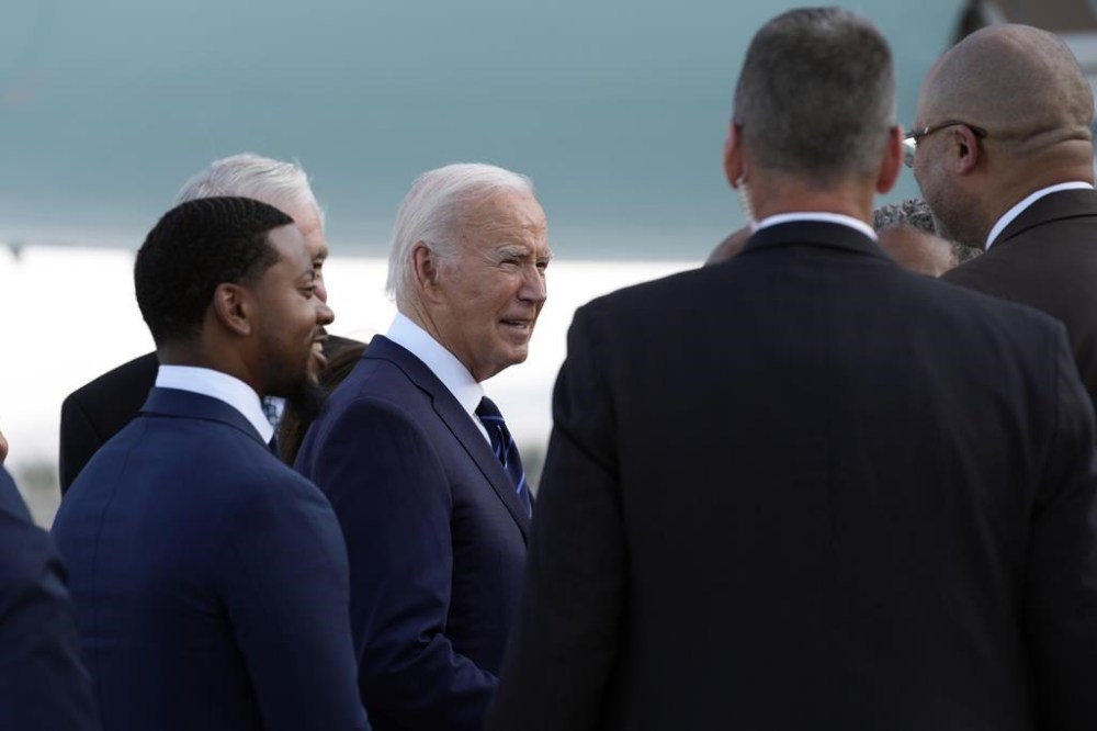 President Joe Biden greets people after arriving at Harry Reid International Airport in Las Vegas, Monday, July 15, 2024. (AP Photo/Susan Walsh)