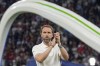 England's manager Gareth Southgate applauds to supporters at the end of the final match between Spain and England at the Euro 2024 soccer tournament in Berlin, Germany, Sunday, July 14, 2024. (AP Photo/Martin Meissner)