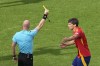 Spain's Robin Le Normand, right, is shown a yellow card by the referee during a quarter final match between Germany and Spain at the Euro 2024 soccer tournament in Stuttgart, Germany, Friday, July 5, 2024. (AP Photo/Michael Probst)