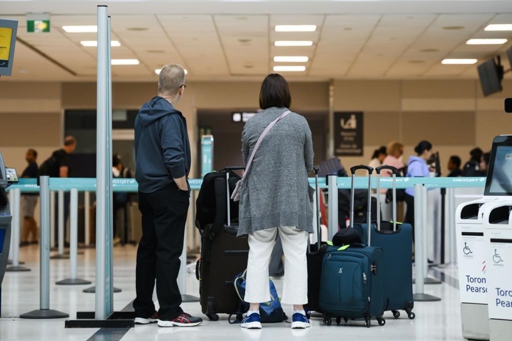 Airfares continue to rise over last year — and soar above pre-pandemic levels Passengers are seen in the WestJet check-in area at Pearson International Airport, in Toronto, Saturday, June 29, 2024. THE CANADIAN PRESS/Christopher Katsarov
