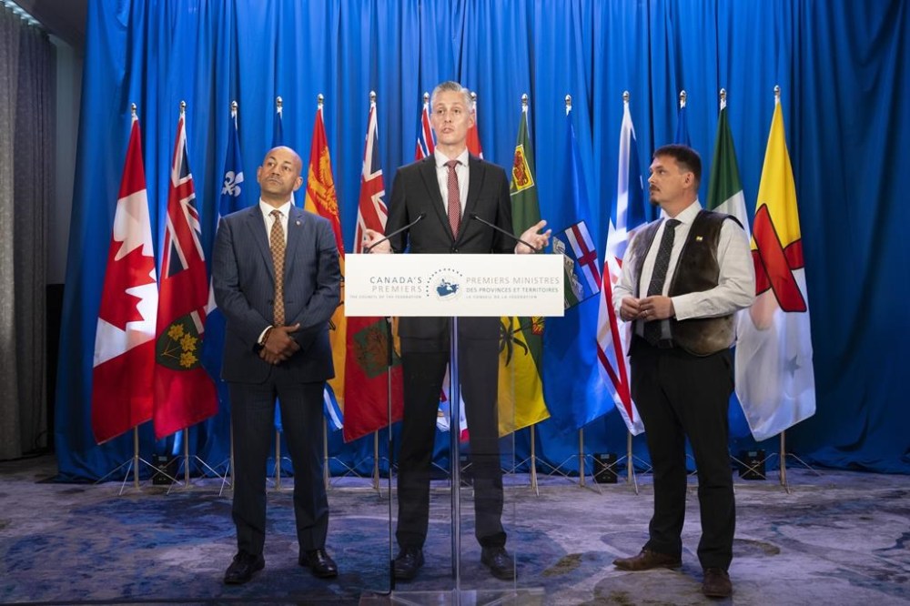 Northern premiers, from left to right, Yukon's Premier Ranj Pillai, Northwest Territories Premier R.J. Simpson, and Nunavut Premier P.J. Akeeagok speak to reporters prior to meeting with Canada's other premiers at the Council of the Federation meetings in Halifax on Tuesday, July 16, 2024. THE CANADIAN PRESS/Darren Calabrese