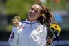 FILE - Nevin Harrison, of the United States, holds her up gold medal after winning the women's canoe single 200m final at the 2020 Summer Olympics, Thursday, Aug. 5, 2021, in Tokyo, Japan. Harrison is 22 years old and the defending Olympic gold medalist in canoe 200 sprint. She is a rock star in her sport and a certain threat to get back on the podium at the Paris Games.(AP Photo/Lee Jin-man, File)