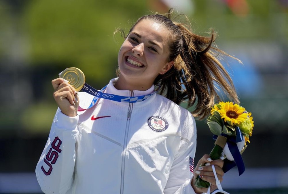 FILE - Nevin Harrison, of the United States, holds her up gold medal after winning the women's canoe single 200m final at the 2020 Summer Olympics, Thursday, Aug. 5, 2021, in Tokyo, Japan. Harrison is 22 years old and the defending Olympic gold medalist in canoe 200 sprint. She is a rock star in her sport and a certain threat to get back on the podium at the Paris Games.(AP Photo/Lee Jin-man, File)