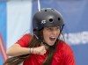Canada's Fay De Fazio Ebert, of Toronto, celebrates during her gold medal performance, while wearing on feather from her pet duck in her helmet, at the Women's Park Skateboarding at the Pan American Games in Santiago, Chile on October 22, 2023. THE CANADIAN PRESS/Frank Gunn