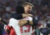 Canada defender Alphonso Davies (19) celebrates with head coach Jesse Marsch after their win over Venezuela in a Copa America quarterfinal soccer match in Arlington, Texas on July 5, 2024. THE CANADIAN PRESS/AP, Richard Rodriguez